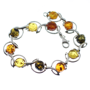 Pulsera hecha en ámbar con plata de ley, círculos de colores